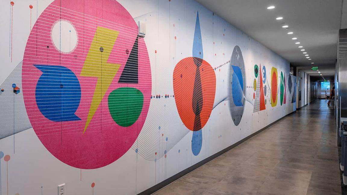 Corridor with a full-length graphic mural in bright colours